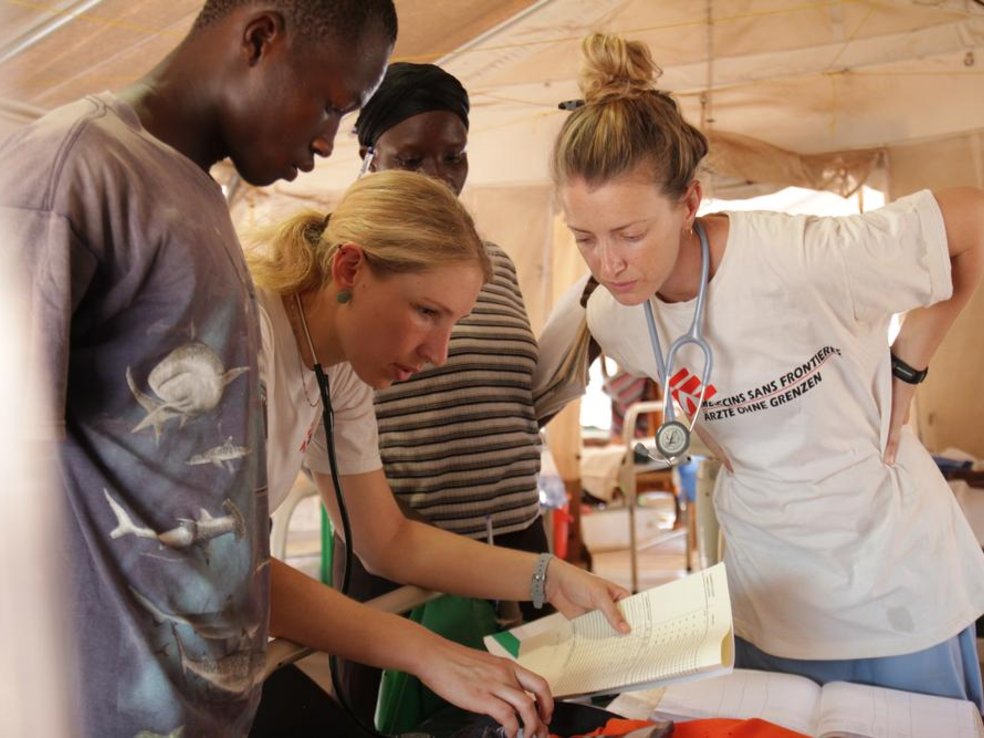 South Sudan, Maban, South Sudan, Translator Jabriel, MD Steffi and Nurse Lilly doing their medical round at the MSF hospital in Jamam, South sudan.